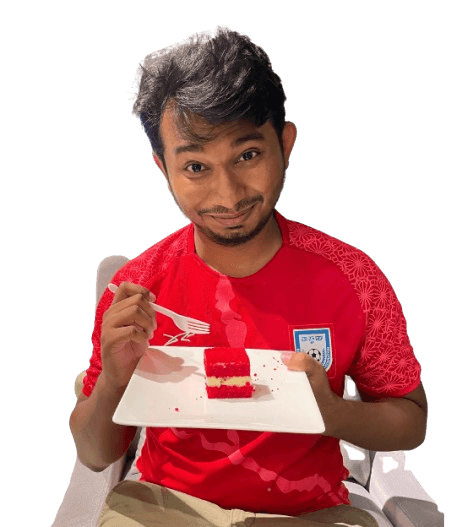 Shafayat Hossain in a red football jersey, eyebrow raised, about to eat a slice of red velvet cake
